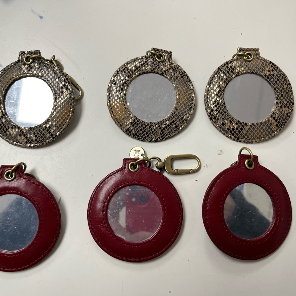 Hobo clip on mirrors to attach to your bag. See photo
